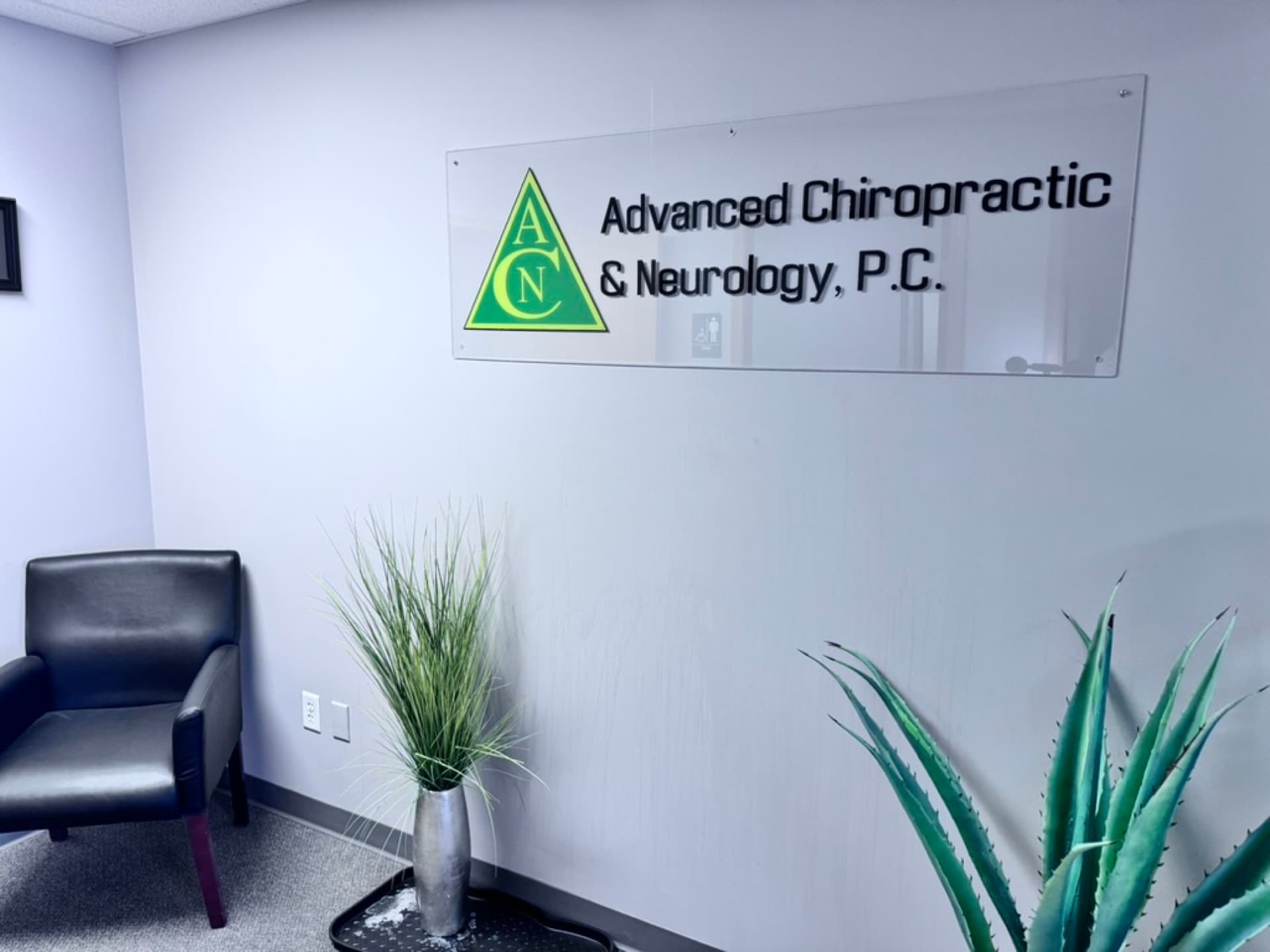 Advanced Chiropractic and Neurology lobby sign and waiting area in La Vista, NE