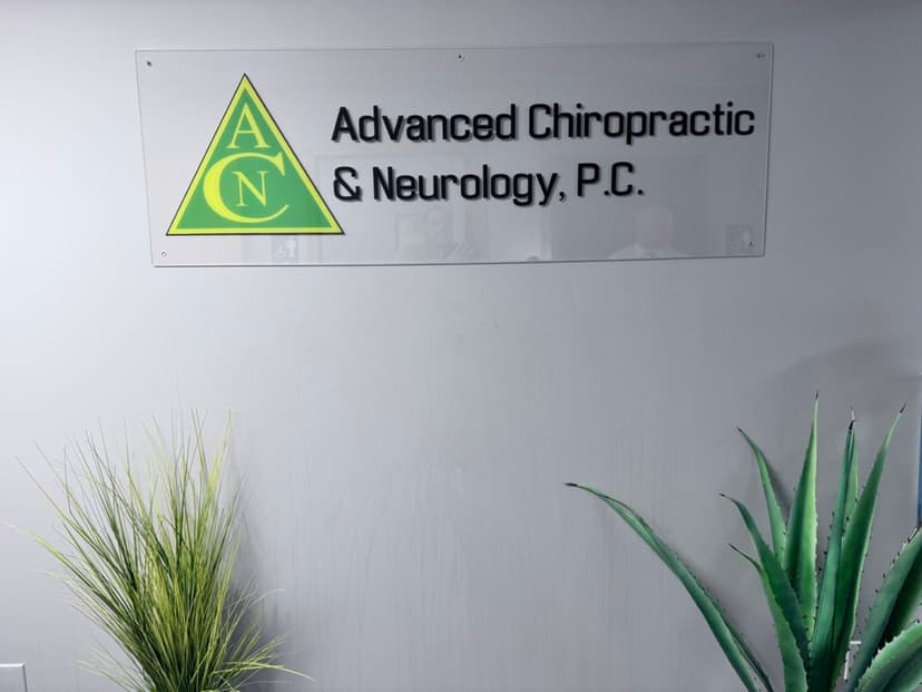 Advanced Chiropractic and Neurology office sign with plants in La Vista, NE
